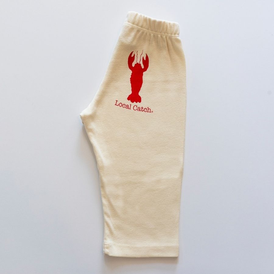 Beige sweatpants with a red lobster graphic and 'Local Catch' text on a light gray background