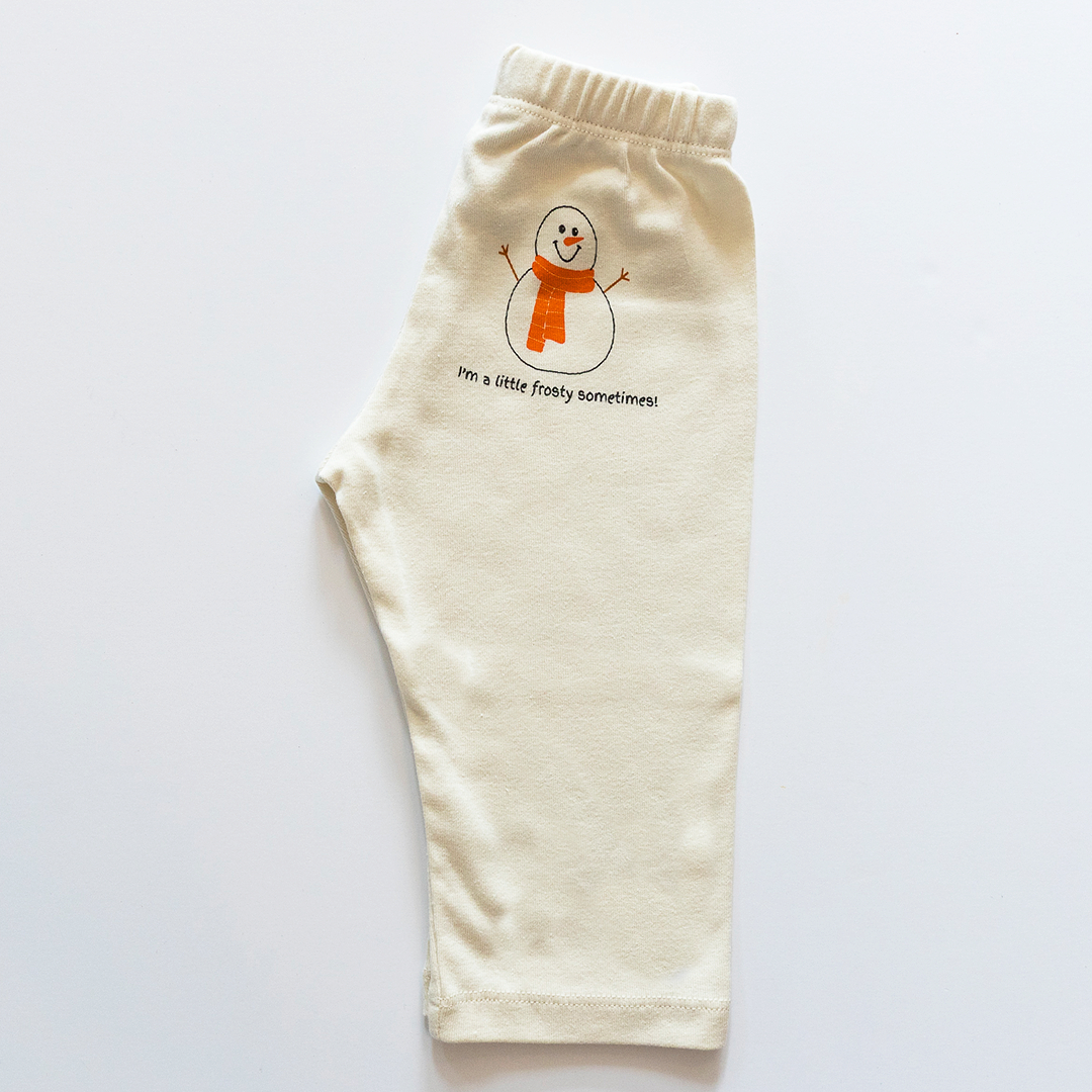Beige pants with a snowman design and text on a white background