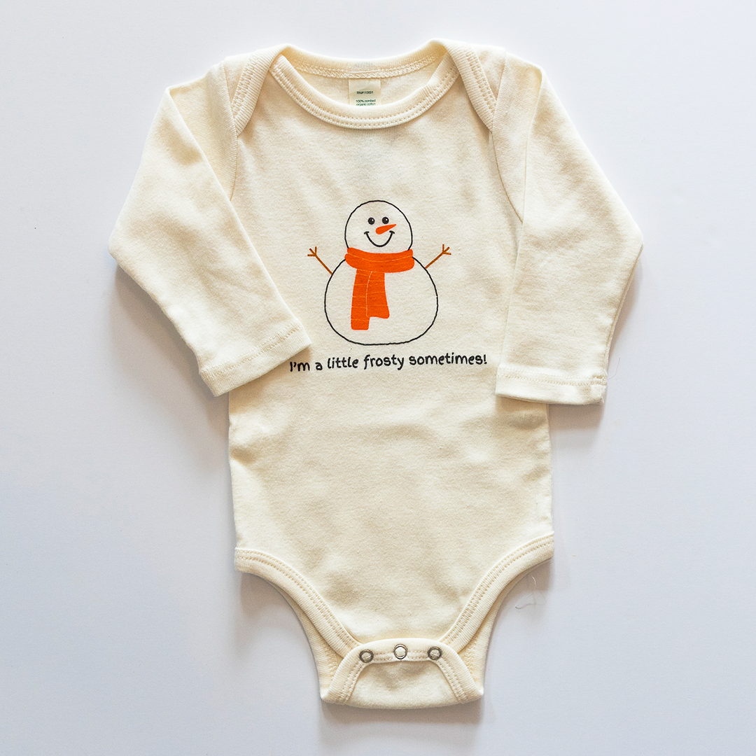 Baby onesie with a snowman design and text on a white background