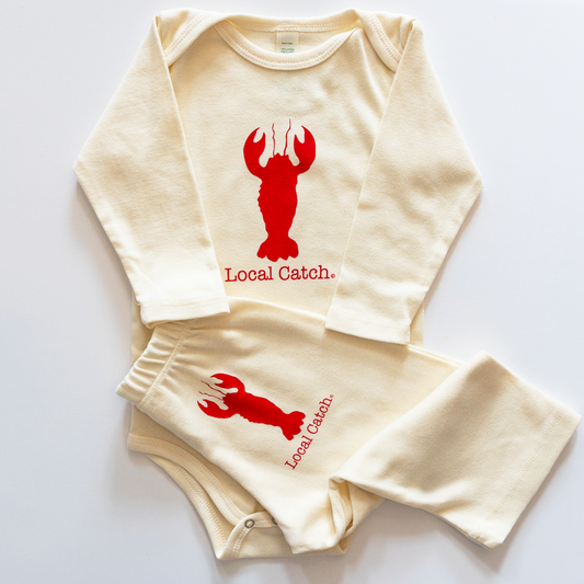 Baby outfit with red lobster design and 'Local Catch' text on a white background