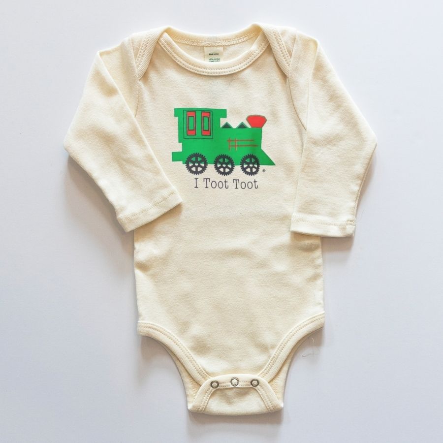 Beige baby onesie with a green train design and text on a white background
