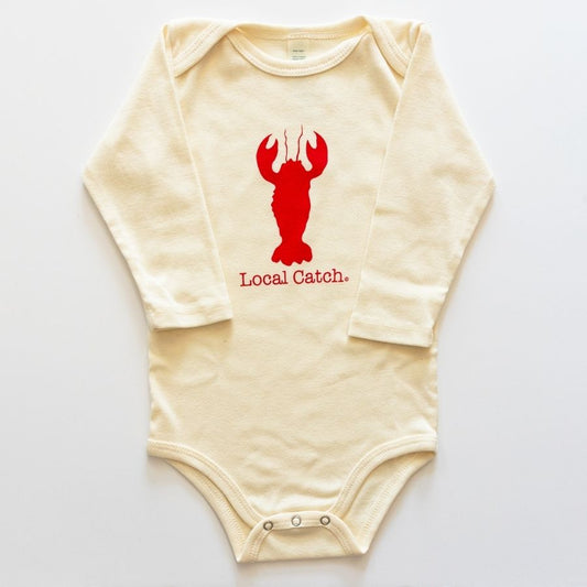 Beige baby onesie with red lobster graphic and 'Local Catch' text on a white background