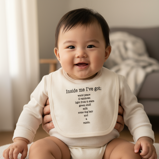 Asian baby wearing Inside Me Poem bib over plain romper