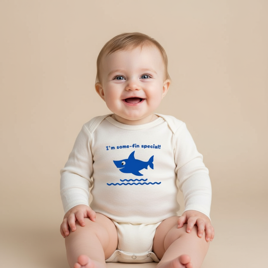Baby boy wearing shark long sleeve romper